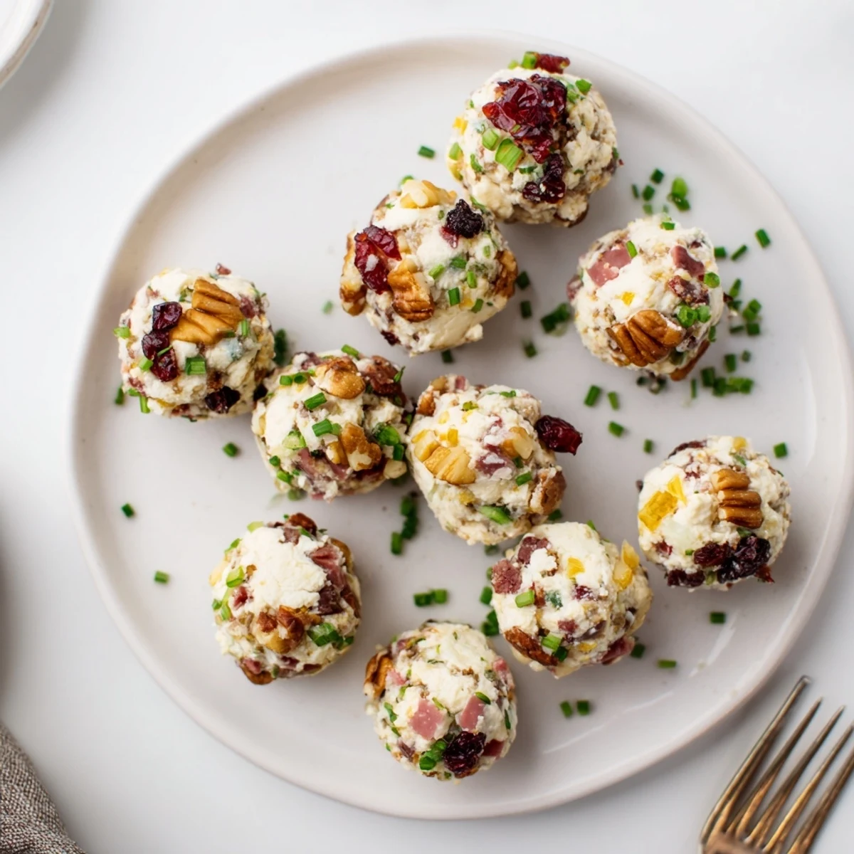 Bite-sized snack balls inspired by charcuterie, perfect for holiday gatherings.  