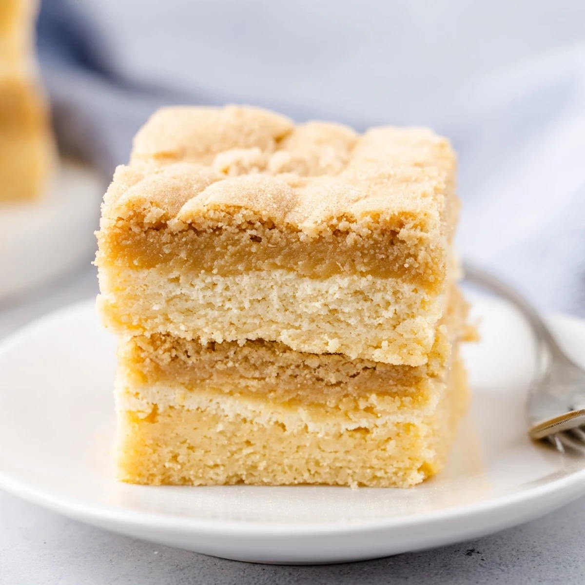 Flaky Chai Biscuit Blondies topped with crisp biscuits and fragrant chai spices.  