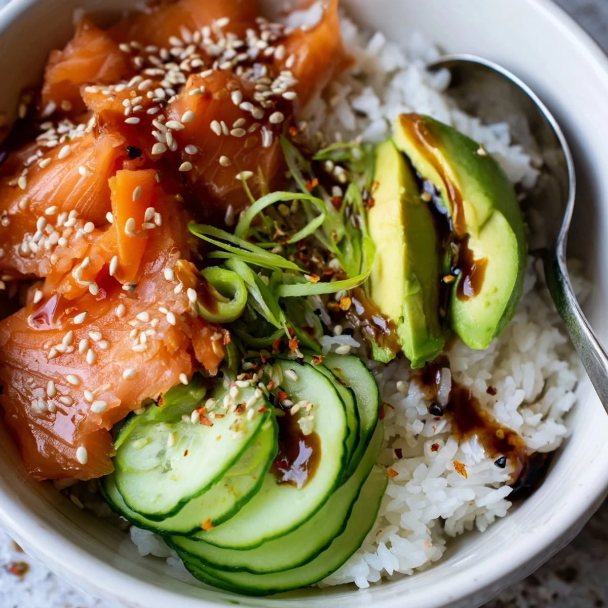 Fluffy rice and buttery salmon create a colorful Leftover Salmon & Rice Bowl.  