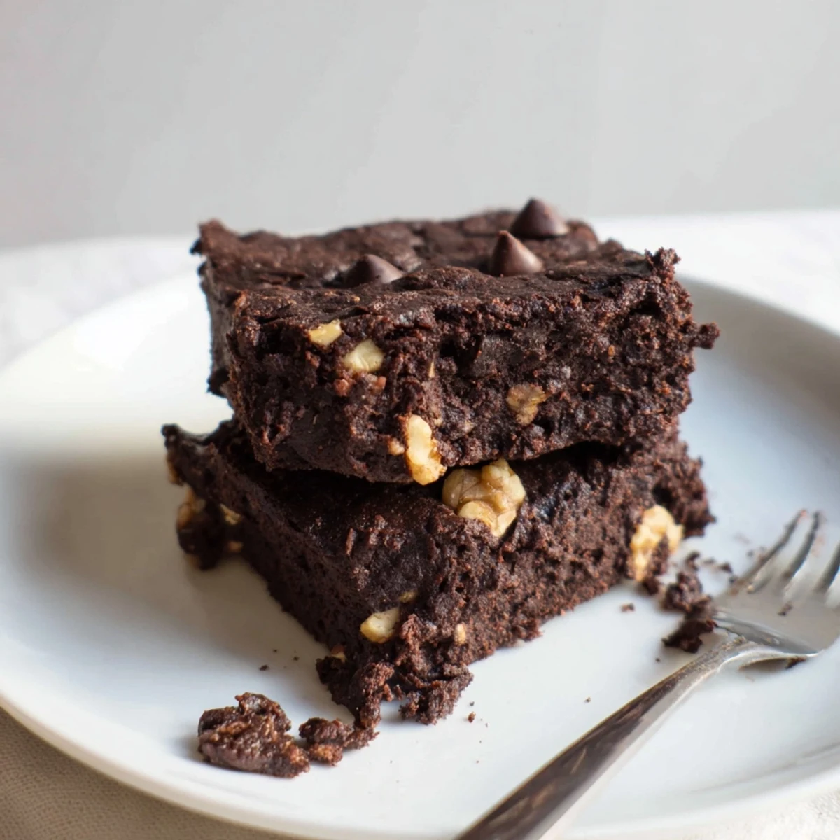Fudgy Zero-Waste Brownies using nut-milk pulp, topped with dark chocolate chips.  