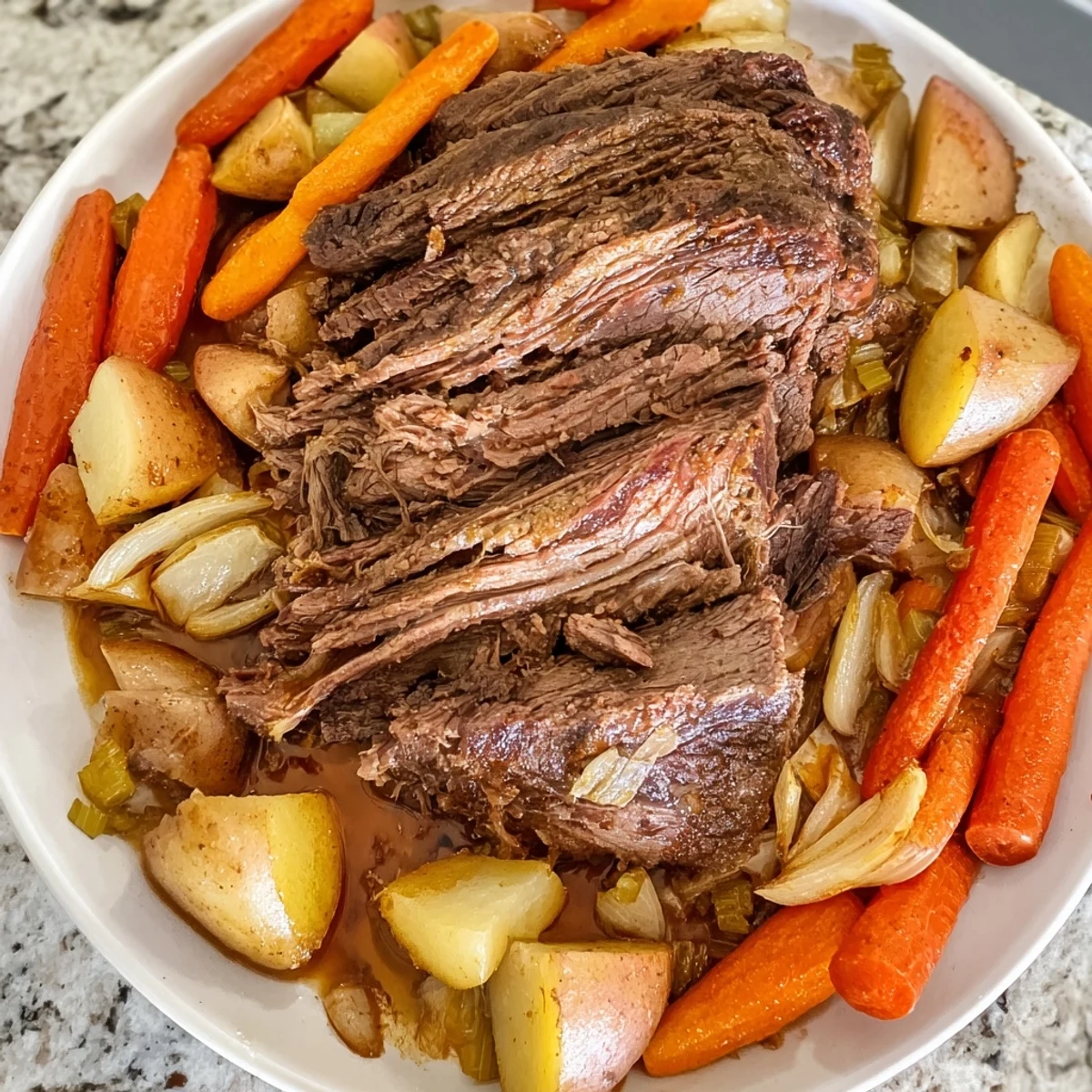 Sizzling close-up of a flavorful Sunday Pot Roast, showcasing tender meat and roasted vegetables.