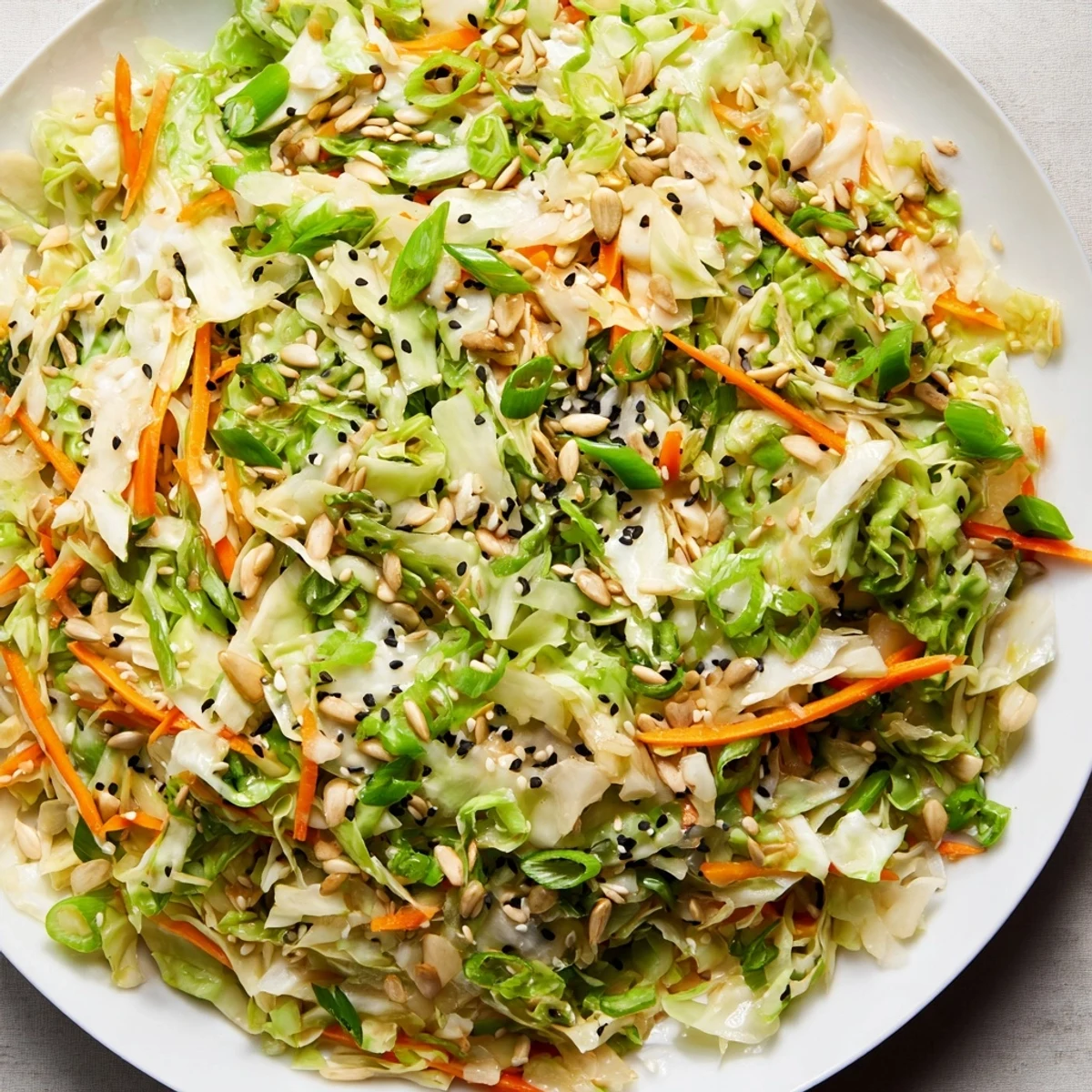 Crisp Cabbage-Core Slaw Salad, bursting with vibrant veggies and a nutty sesame dressing, looks so fresh.