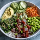 Savory canned tuna poke bowl with creamy avocado and crisp garden vegetables.