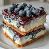 Bright No-Bake Lemon Blueberry Cheesecake Bars, a refreshing dessert with zesty lemon and berries.