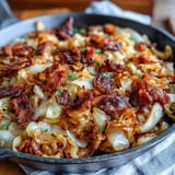 Tender sautéed cabbage, smoky bacon, and sweet onions ready for dinner.