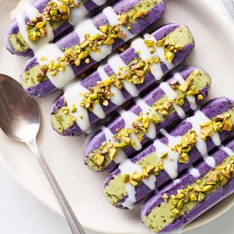 Creamy ube and pistachio ice cream bars drizzled with sweetened condensed milk.  