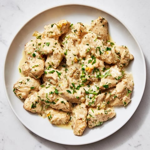 Golden chicken breasts smothered in creamy tarragon sauce, a lighter version of classic French cuisine.