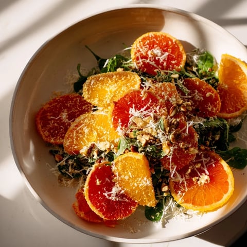 Winter Citrus & Candied Pecan Salad, a colorful mix of citrus, goat cheese, and crunchy pecans.