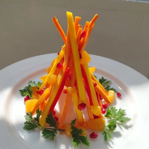 Bonfire Warmth Centerpiece: A visually stunning arrangement of colorful fruits and vegetables mimicking a warm bonfire.