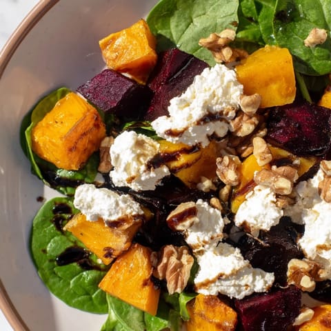 A delicious mix of textures and flavors in this roasted beet, butternut, and spinach salad.