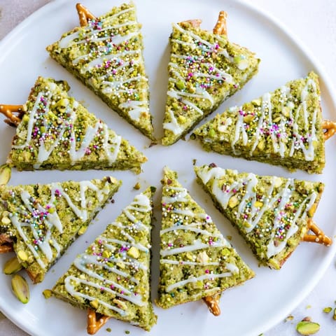 Earthy matcha green Matcha Pistachio Christmas Tree Blondie Bars are studded with pistachios creating a delicious holiday dessert.