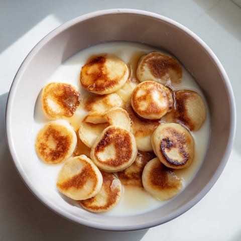Tiny, perfectly cooked fluffy pancake cereal, crispy edges, and ready to be drizzled with sweet maple syrup.
