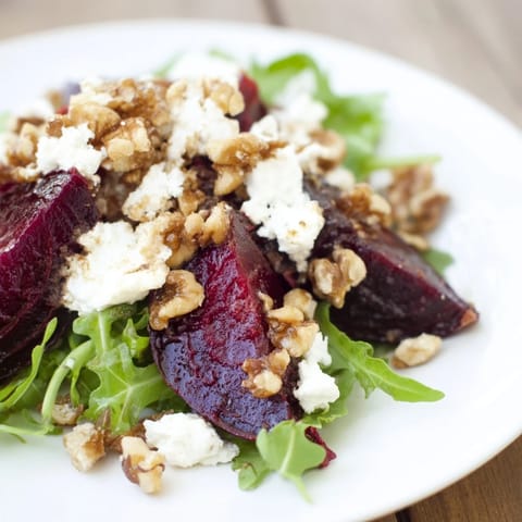 A perfect bowl of Roasted Beet Walnut Salad, a colorful vegetarian delight, ready to eat.