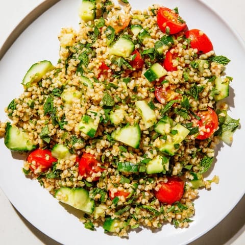 Vibrant bulgur wheat salad Tabbouleh, a Middle Eastern delight, ready to be served.