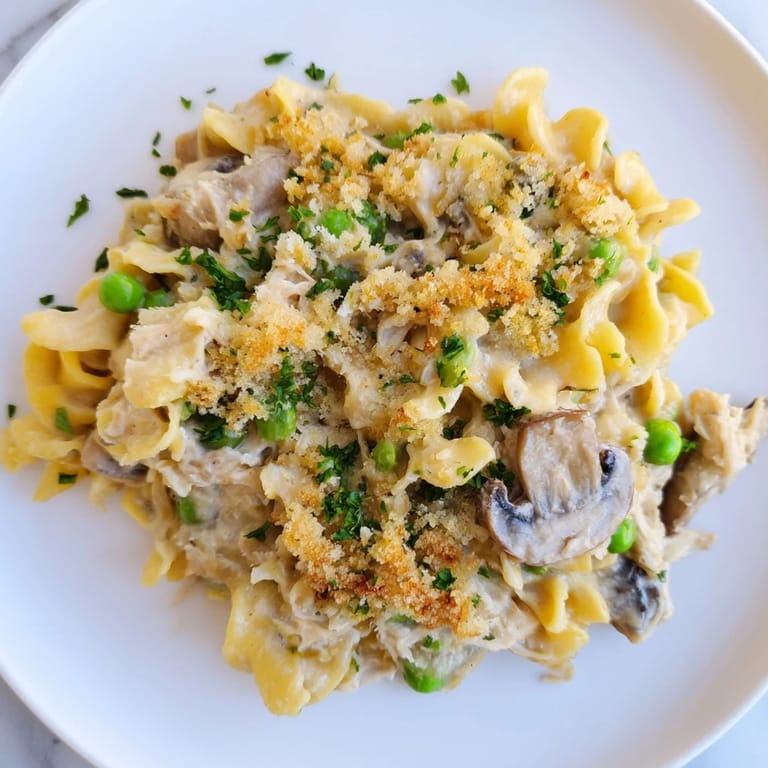 A close-up shot of bubbling tuna noodle casserole, a classic comfort food recipe.