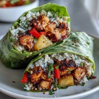 Fresh pineapple chicken and rice lettuce wraps with juicy chicken, sweet pineapple, and crisp lettuce for a tropical, healthy dinner.  